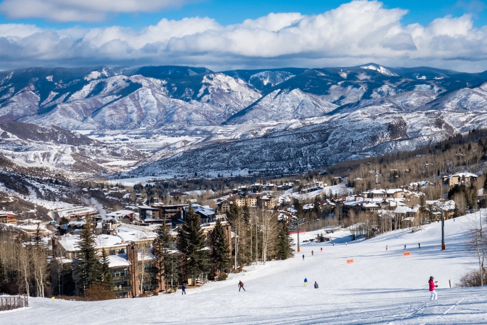 Panoramic,View,Of,Snowmass,Village,,With,Skiers,Skiing,At,The