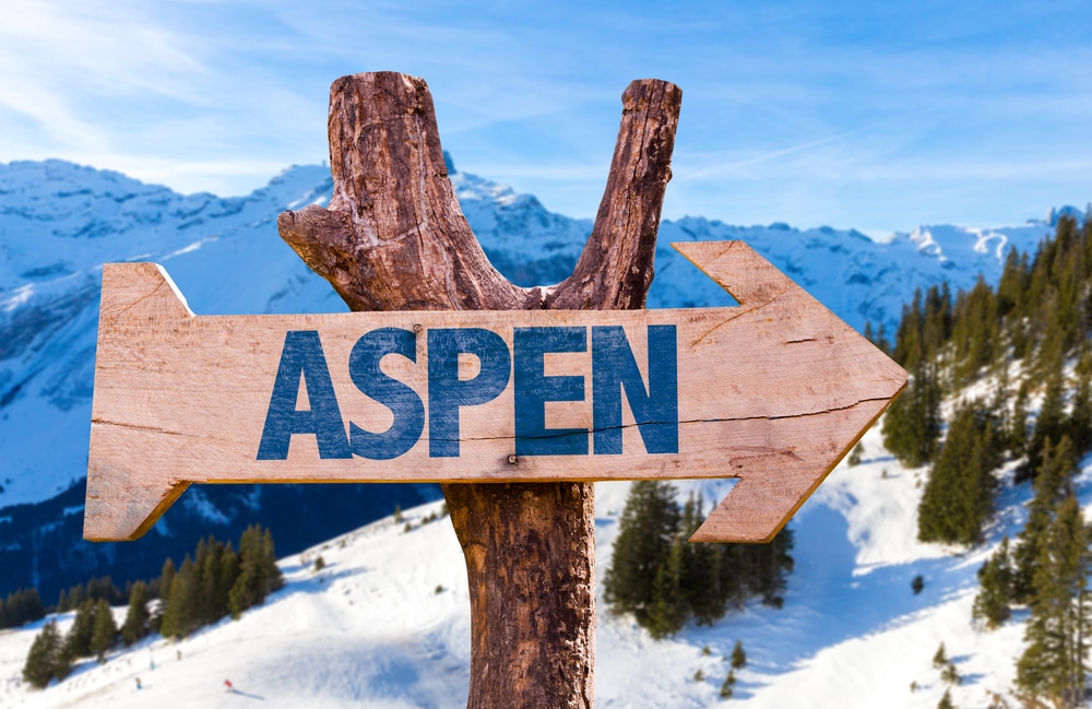 Aspen,Wooden,Sign,With,Alps,Background